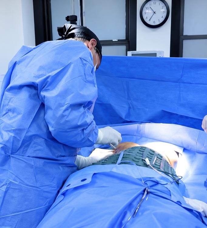 Dr. David Shokrian performing breast revision surgery in a New York City operating room