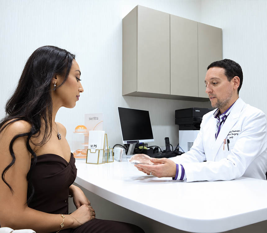 Dr. David Shokrian discussing breast reduction and breast lift options with a patient in NYC